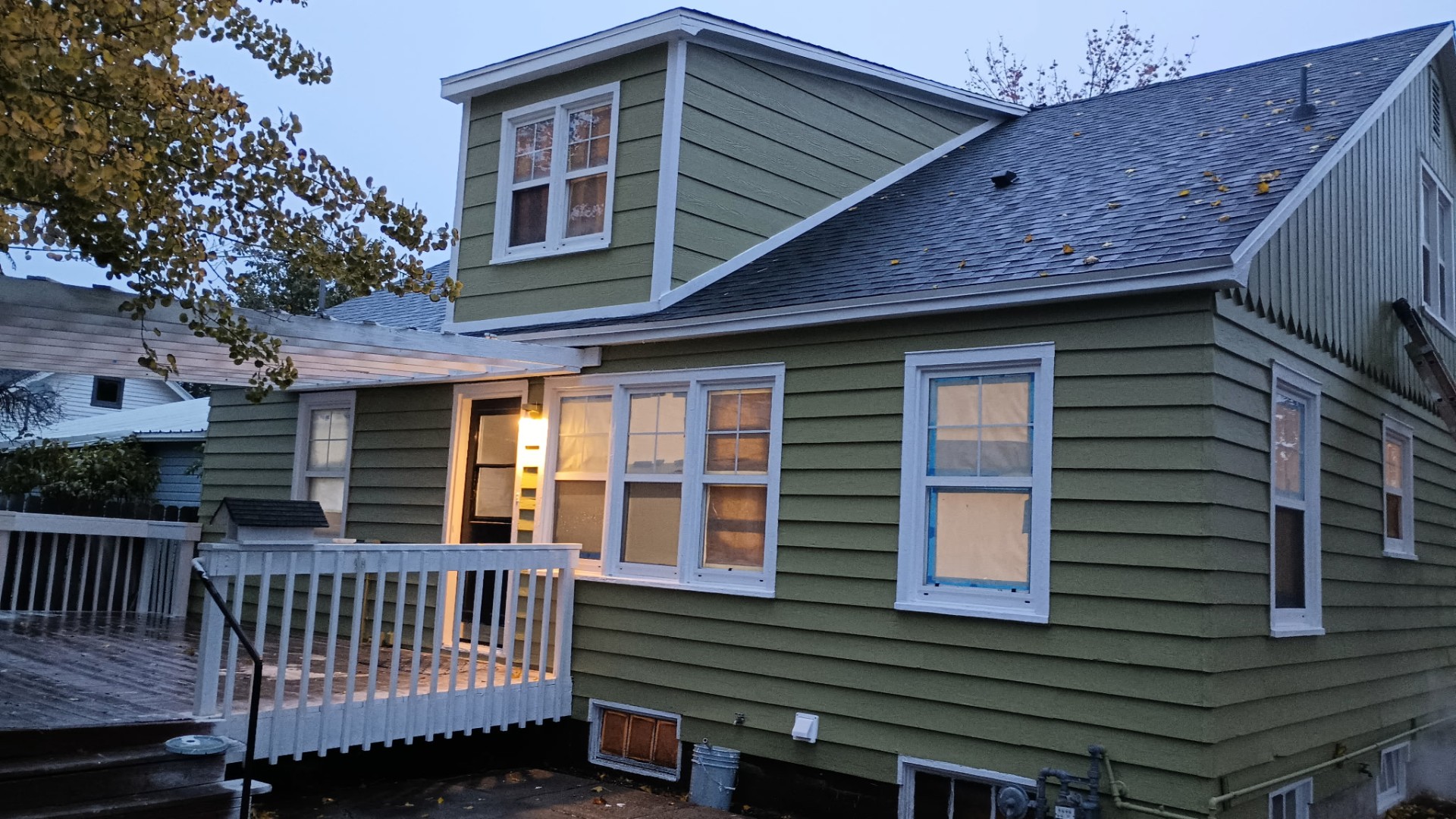 Exterior siding and trim repaint on a two-story home
